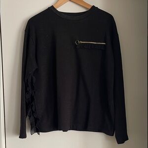 Black Long Sleeve Top with Ruffle Detail.